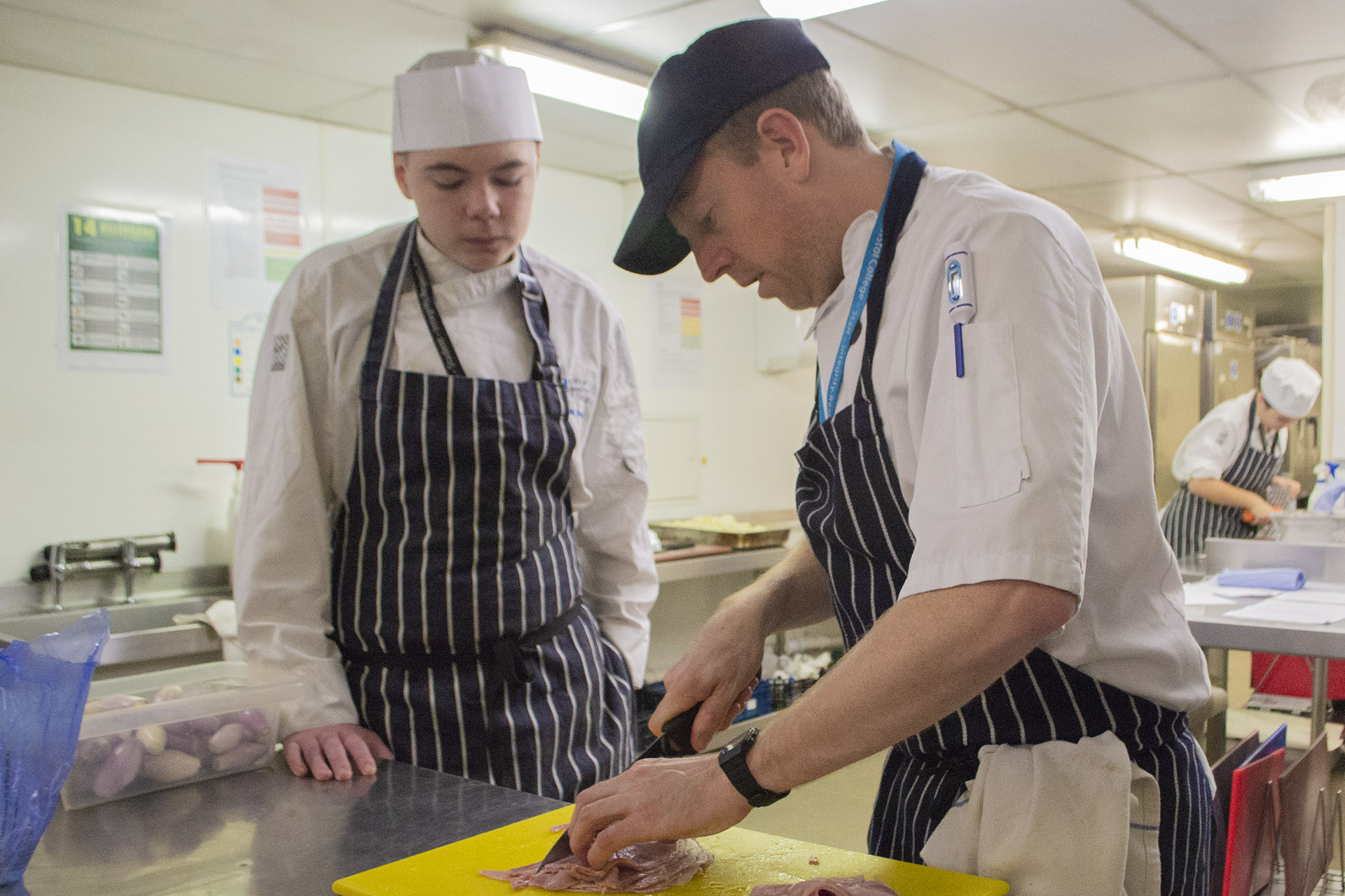 Catering Lecturer Grant Spencer with a student.