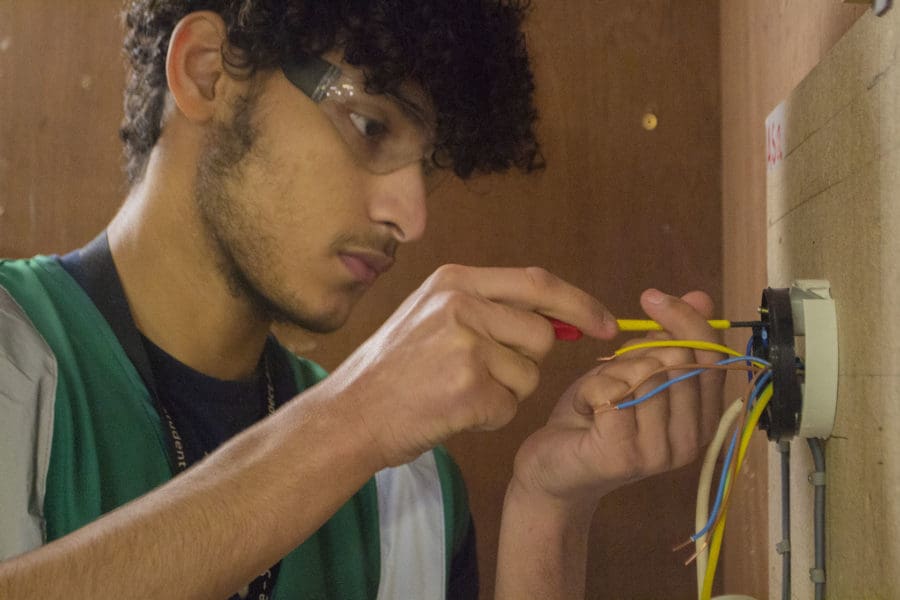 Student installing electrics