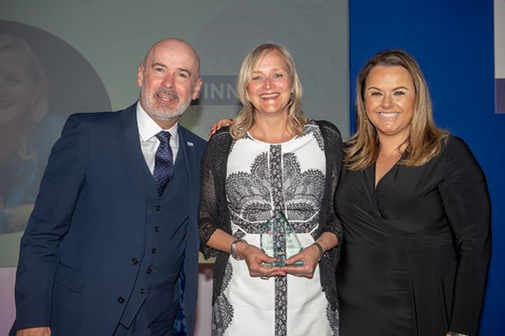 Clare Vertigen, Director of the South West Apprenticeship Company, smiles with two colleagues as she holds her award