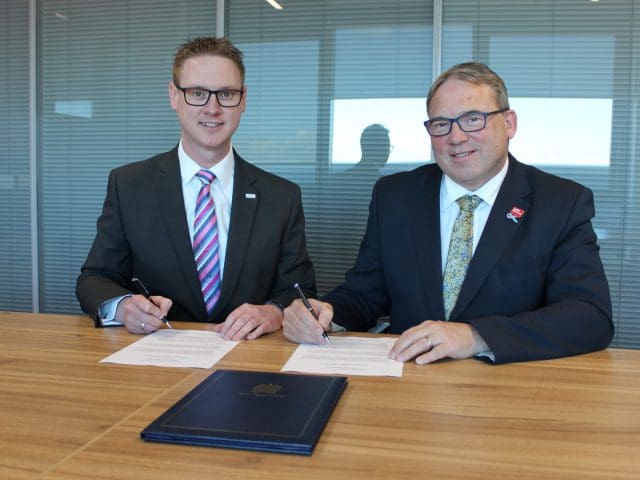 Professor Steve West, Vice-Chancellor of the University of the West of England, and Lee Probert, Principal and Chief Executive at City of Bristol College, sign documents