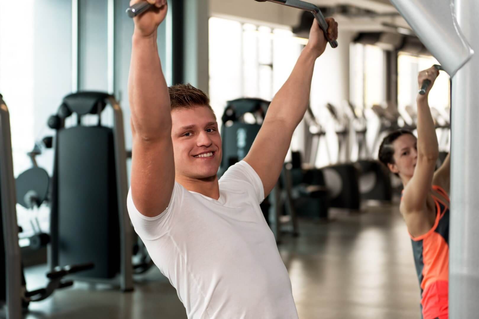 A young man works out in the gym