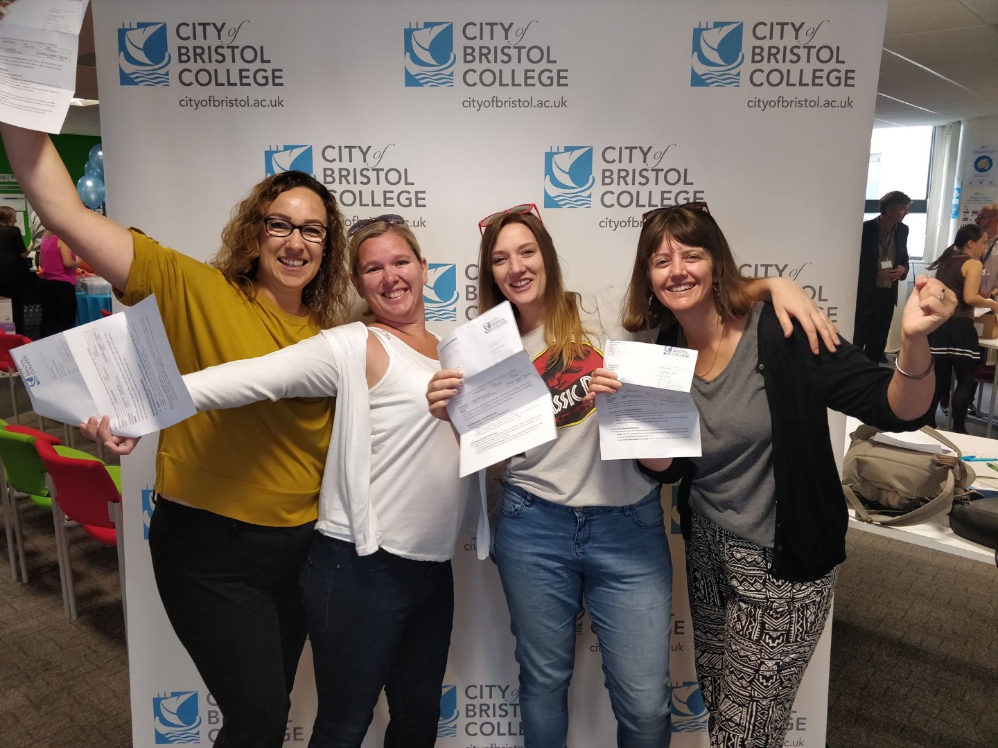 Four women celebrate their results