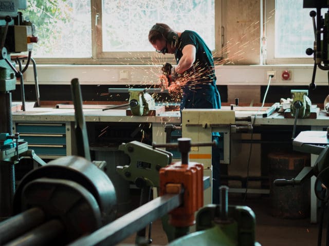 Angle grinder being used in workshop