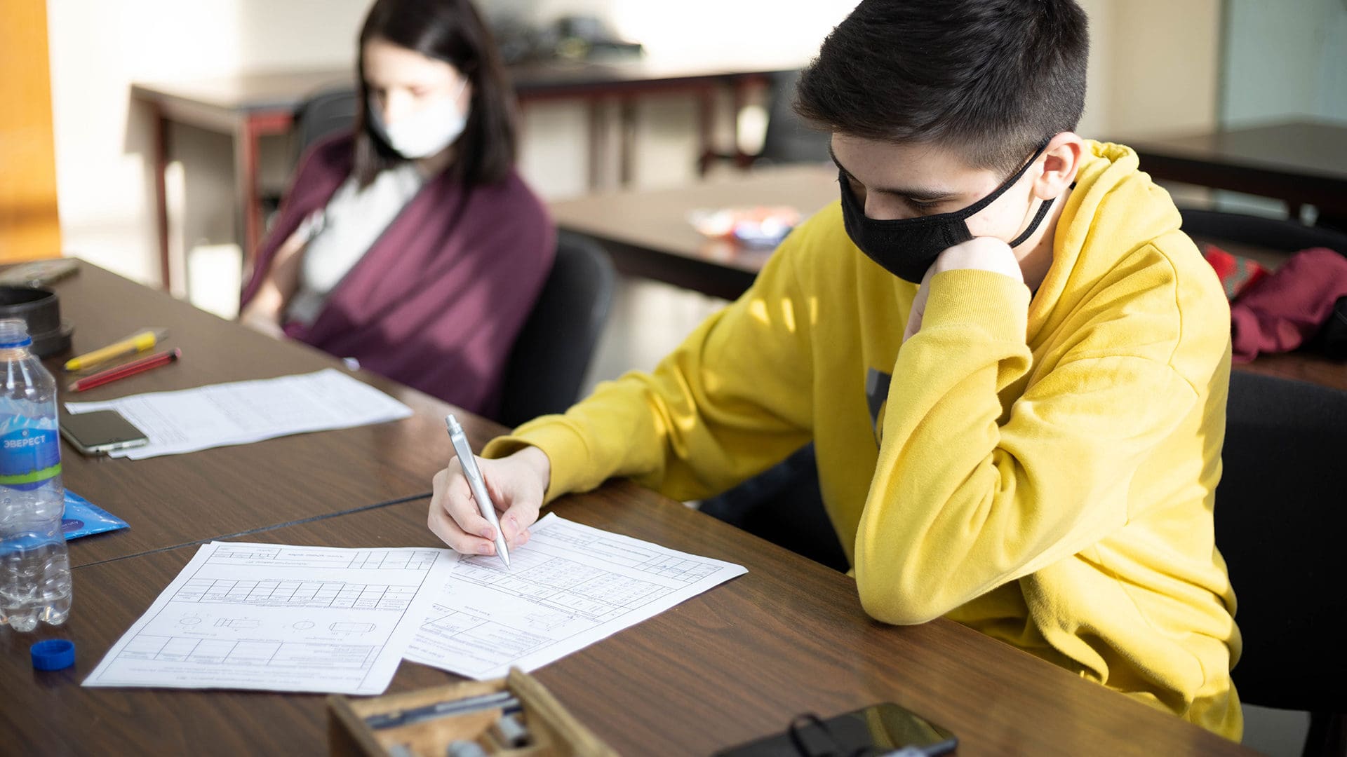Students working wearing masks