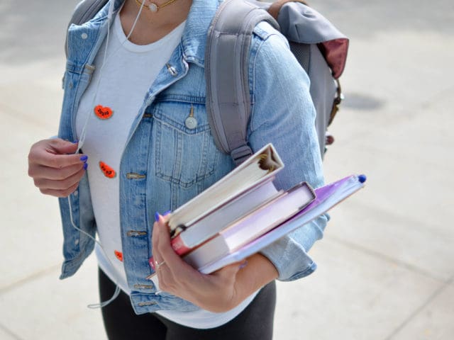Female student carrying books