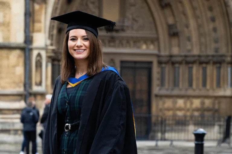 Graduate student smilling.