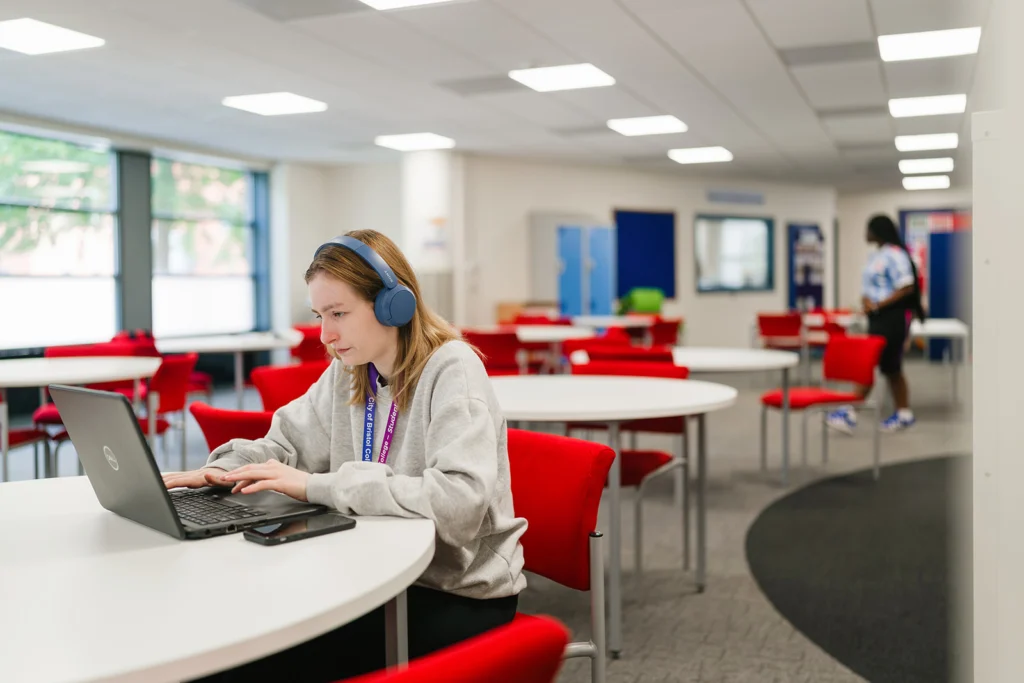 Students using laptop in the library