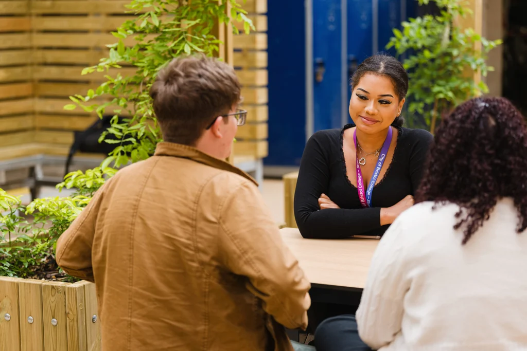 Students sitting outside talking