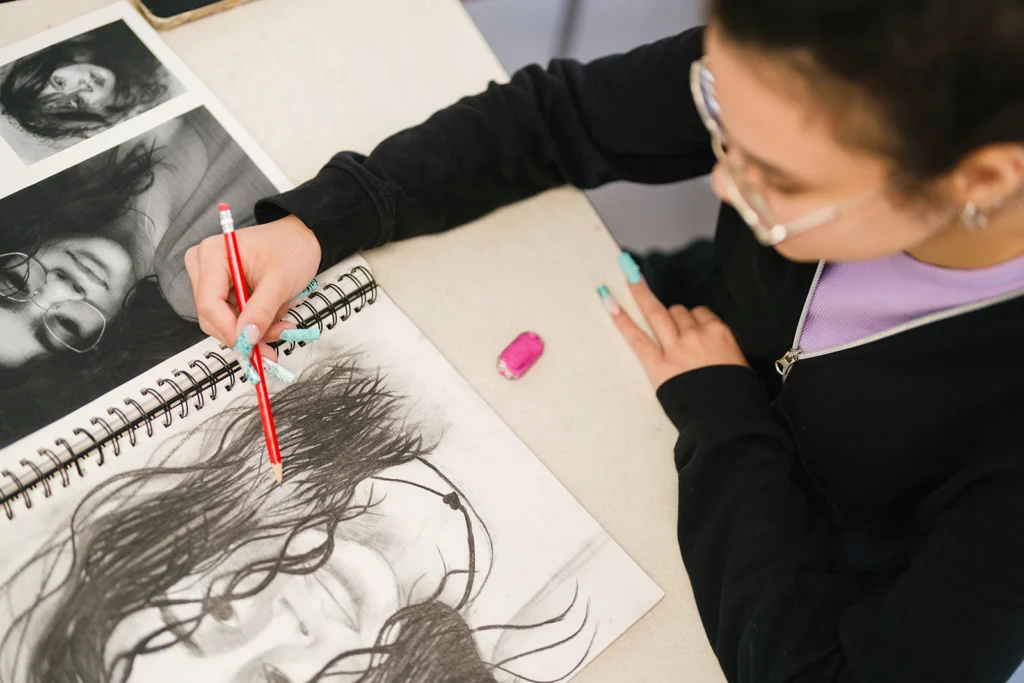 student drawing self portrait