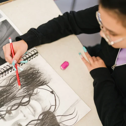 student drawing self portrait