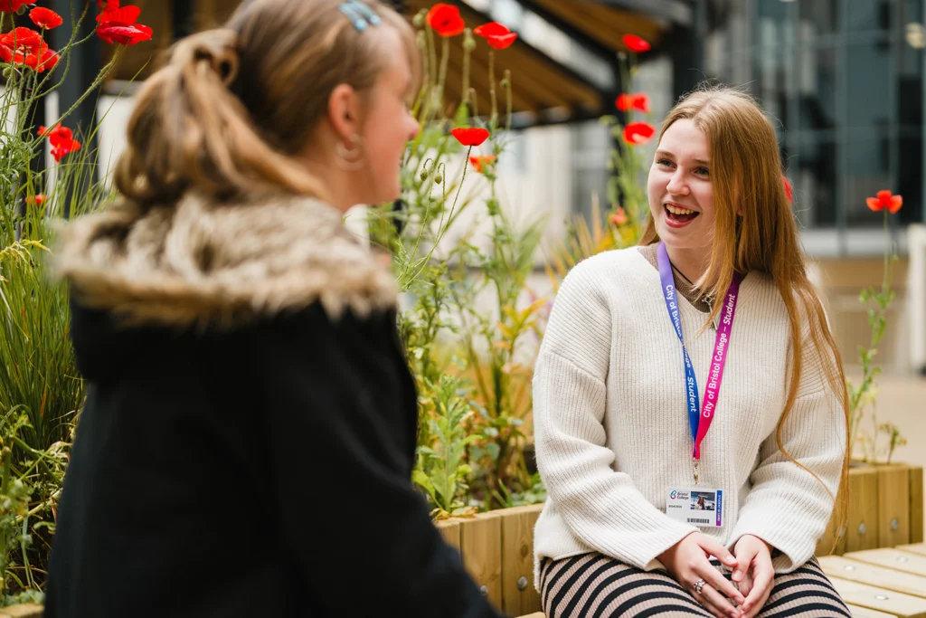 two students chatting in the courtyard