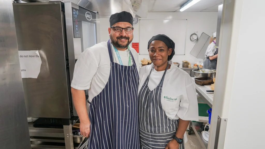 Catering and Hospitality Lecturer, Ryan Fernandes, pictured with a guest chef, Nadine, in the kitchen at the College Green Centre.