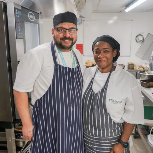 Catering and Hospitality Lecturer, Ryan Fernandes, pictured with a guest chef, Nadine, in the kitchen at the College Green Centre.