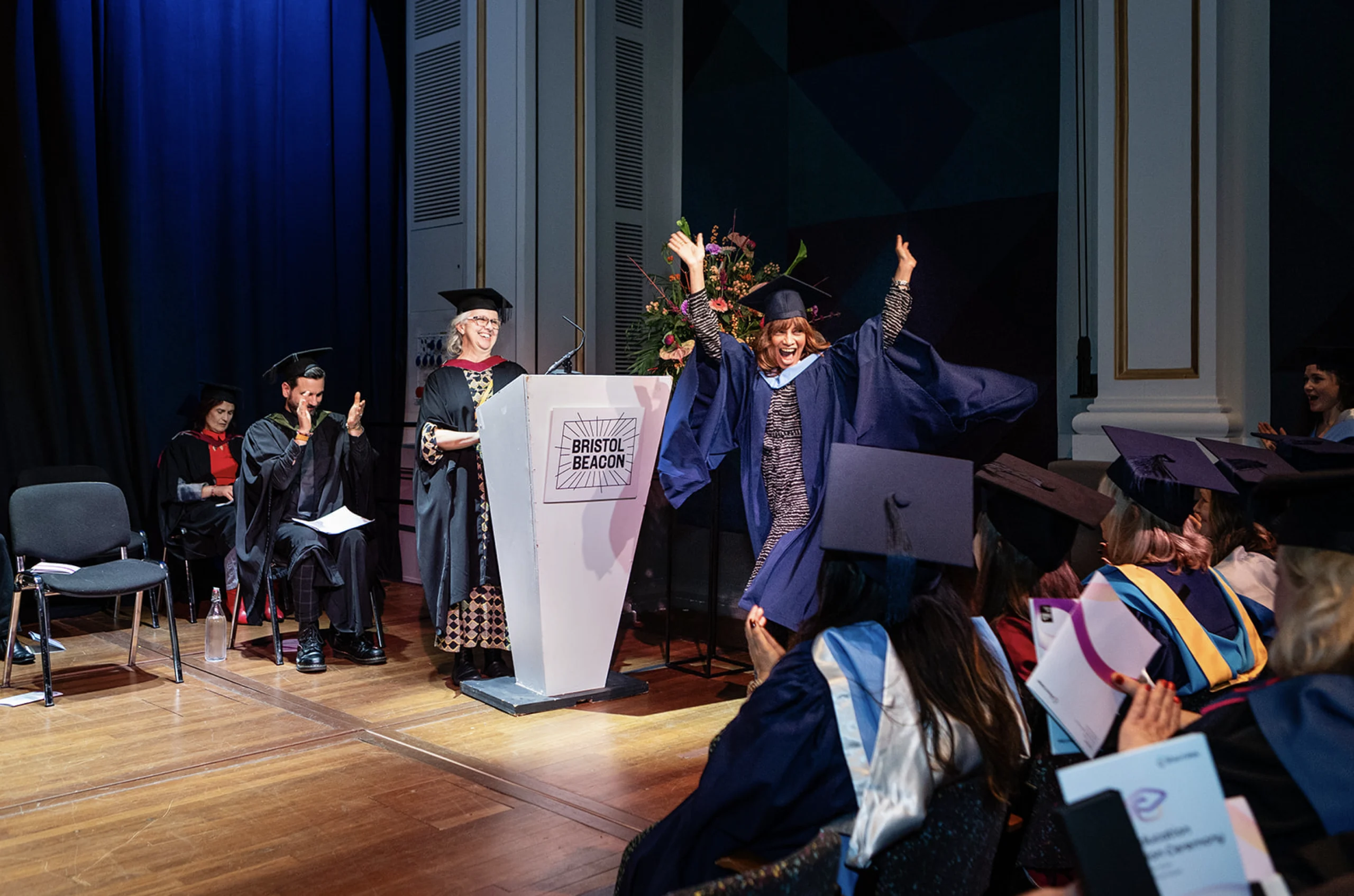 Student walking through the graduation hall
