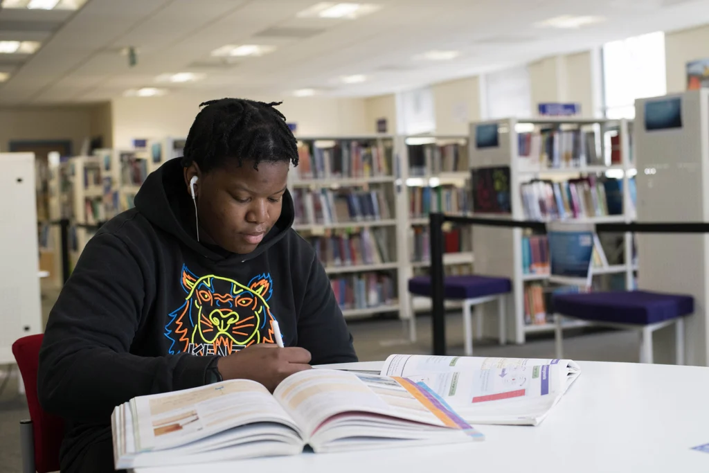 student studying in the library