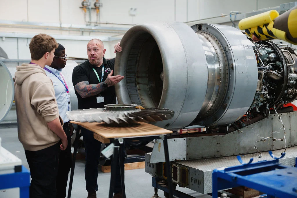 Aeronautical Engineering students pictured with a lecturer in the aeronautical hangar.