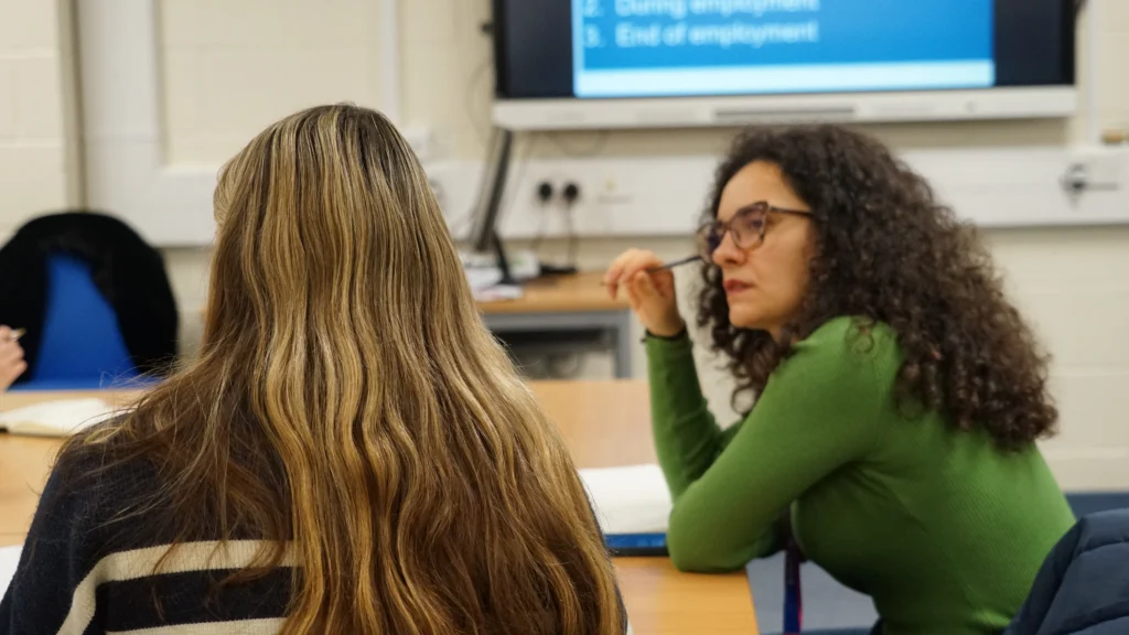 Student listening to another student speak.