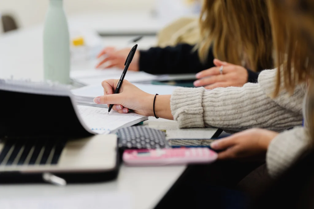 A student taking notes