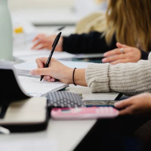 A student taking notes