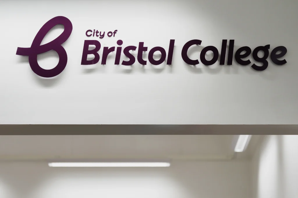 Logo of the college on a wall in Ashley Down