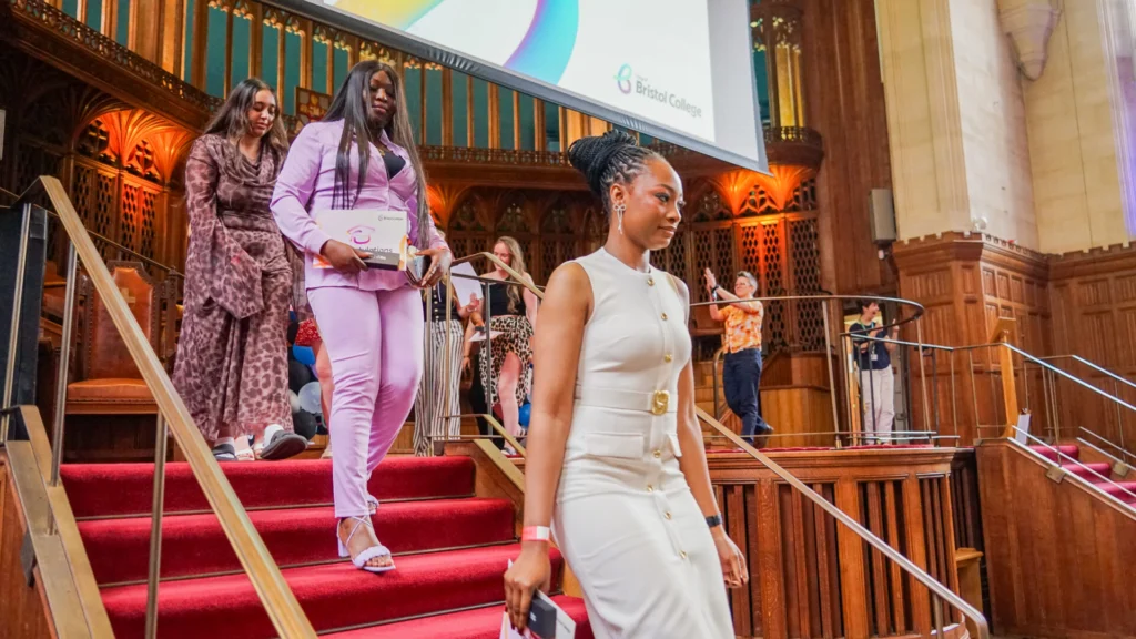 Image shows graduates leaving the stage at the Further Education Graduation Ceremony 2025.