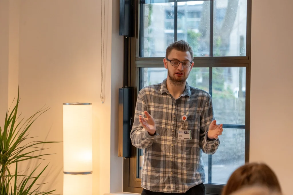 Liam, a student pictured giving a talk.