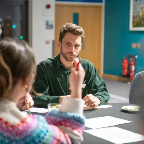 5 people conducting a lunch meeting.
