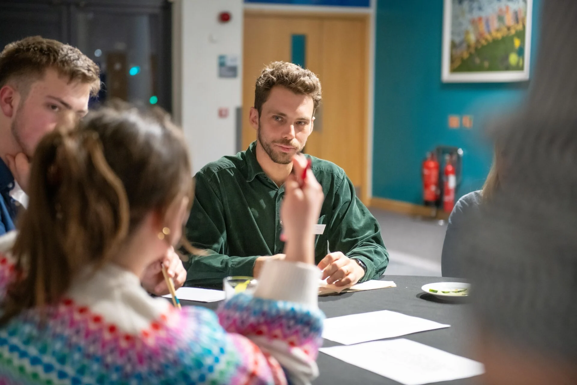 5 people conducting a lunch meeting.