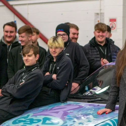 Julia Gray pictured celebrating a 'Good' Ofsted rating with students.