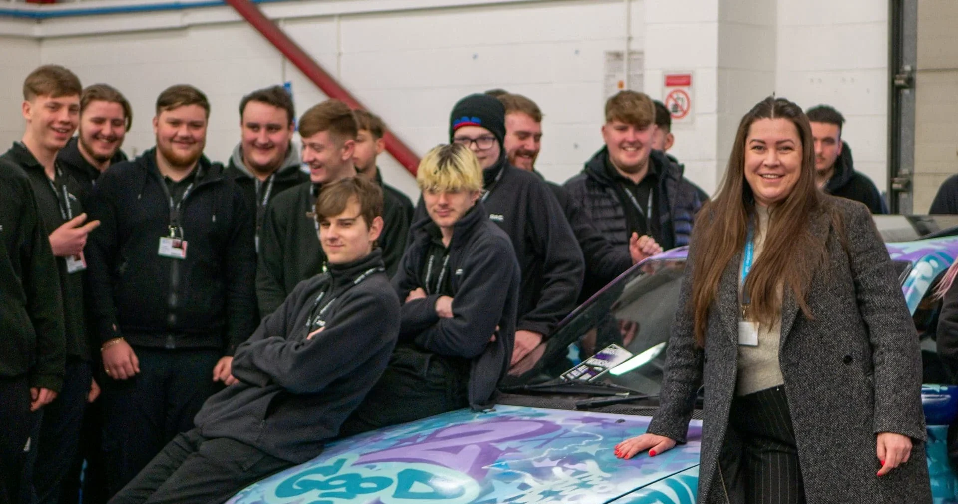 Julia Gray pictured celebrating a 'Good' Ofsted rating with students.