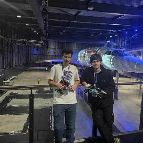 Engineering students competing in an electric car competition at Aerospace Bristol.