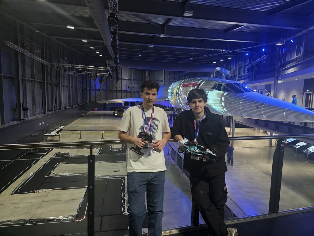 Engineering students competing in an electric car competition at Aerospace Bristol.