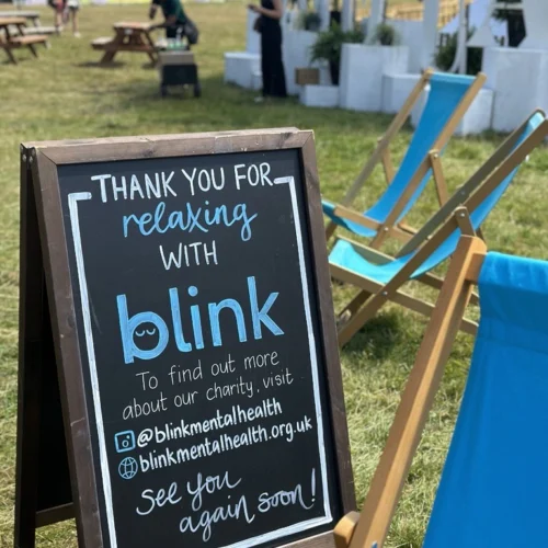 blink mental health sign at a festival.