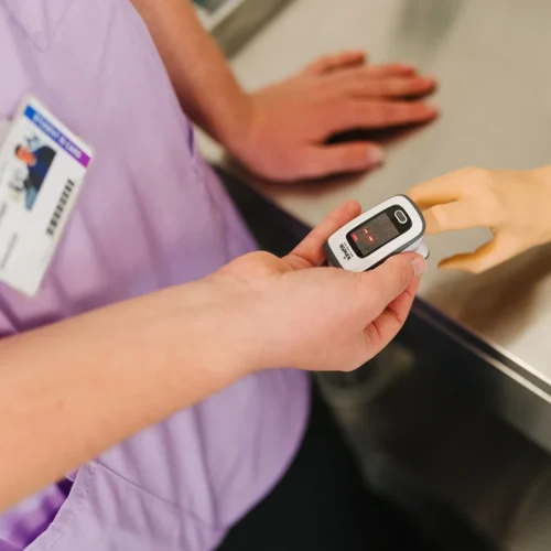Medicine access to HE students measuring a patient