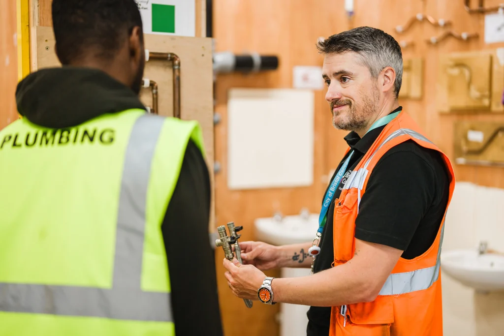 Students learning plumbing