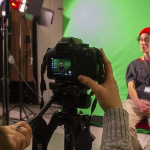Creative media student filming someone